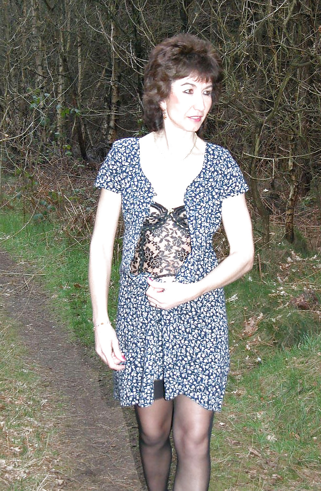 XXX Amateur mature lady takes a walk in the woods.