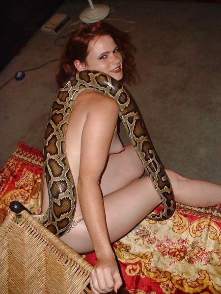 XXX Beautiful girl with a snake
