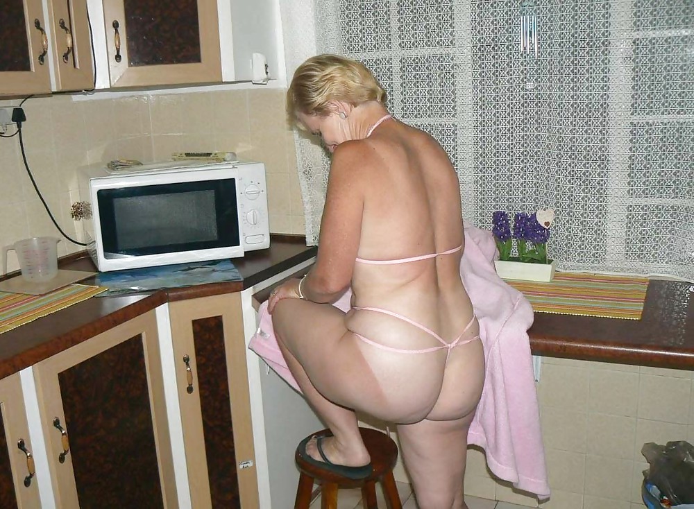 XXX Granny in the kitchen preparing her gray-haired pussy