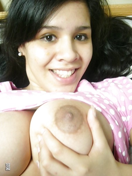 XXX Latin amateur teen with big tits in close-up.