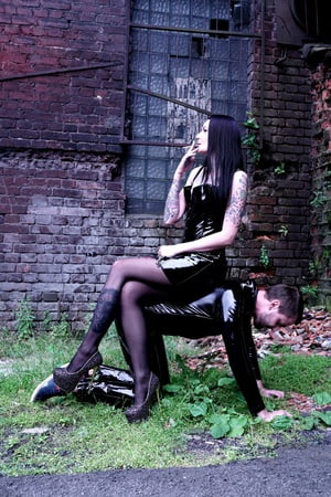 dominatrix nika on a walk with her slave         