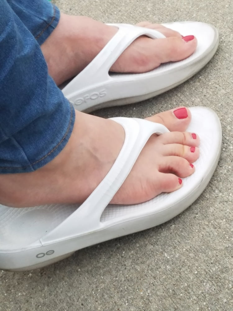 New red toes in white flipflops - 2 Photos 