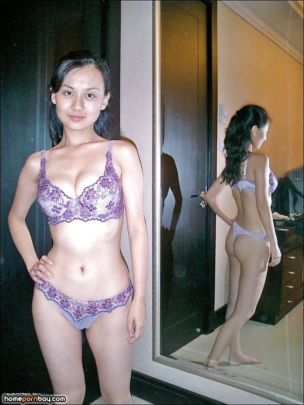 XXX Asian babe strips nude