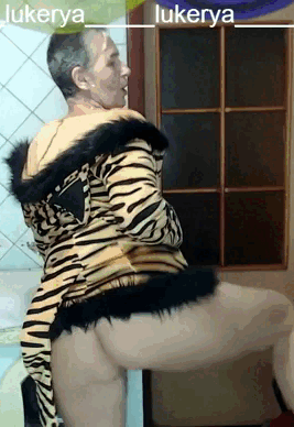 Lukerya in small black panties with a long tiger tail. #5