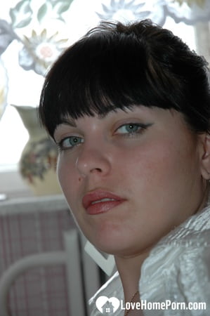 Smoking mom in stockings showing off her legs