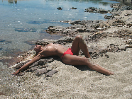 Topless beach babe