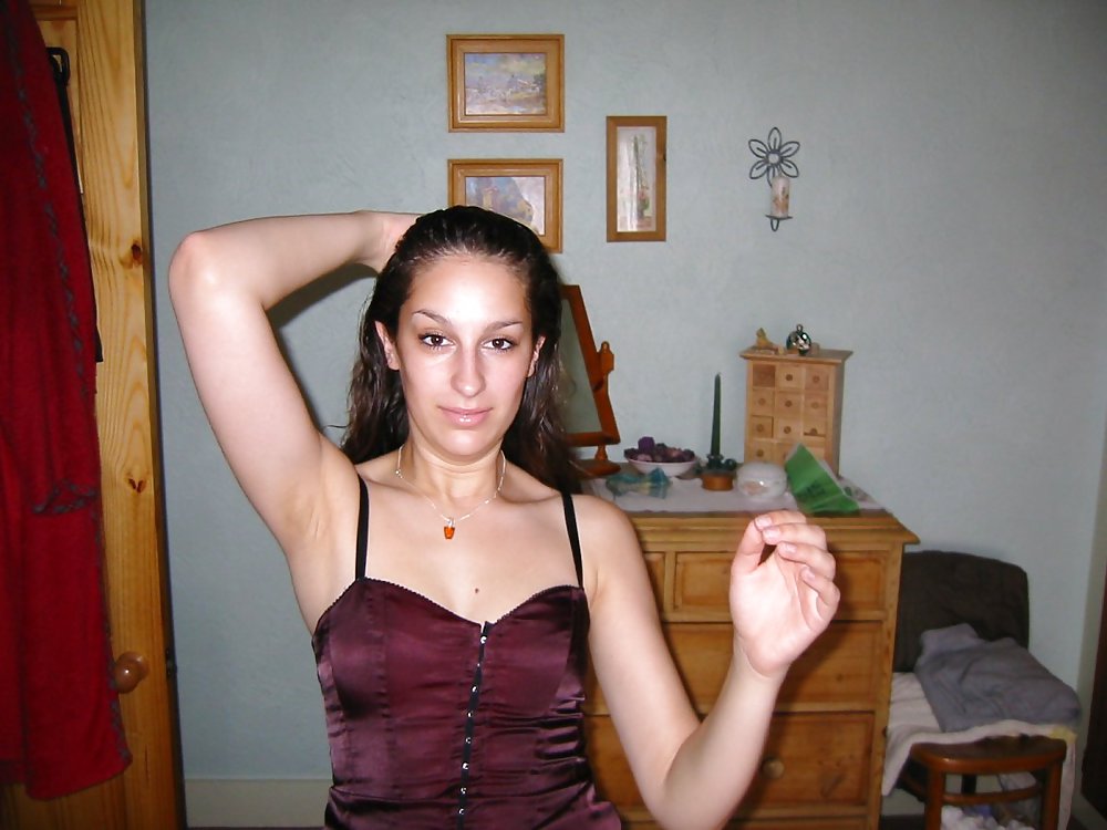 XXX Amateur brunette posing in her bedroom