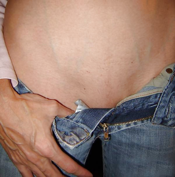 XXX Stripping off her jeans