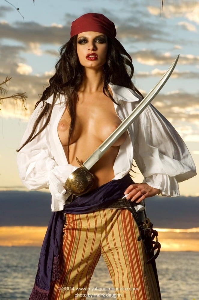 Topless Pirate Woman Covers Her Breasts.