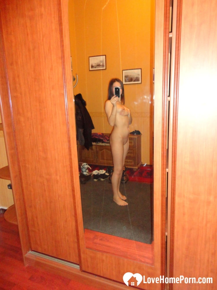 Hot teen shows her body in the mirror
