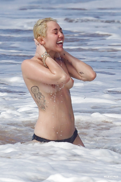 XXX Miley Cyrus swimming topless in Hawaii
