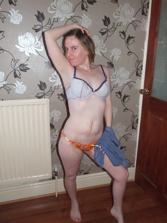 cute blonde posing in jeans and shirt         