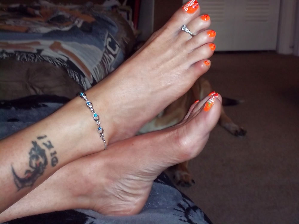 XXX Chance's long tan legs and neon orange toes